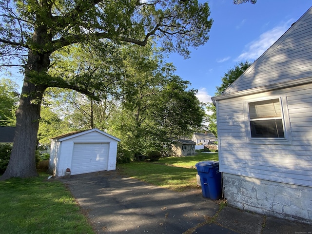 154 Wall St, Meriden, CT 06475 - view of green lawn with an outbuilding, driveway, and a detached garage