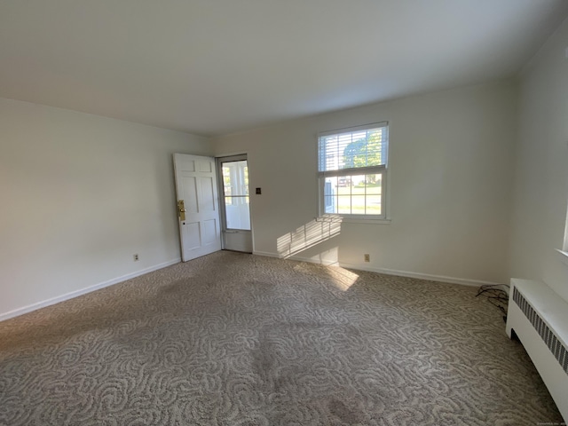 154 Wall St, Meriden, CT 06475 - unfurnished room featuring radiator, carpet floors, and baseboards