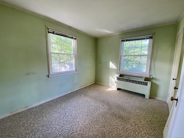 154 Wall St, Meriden, CT 06475 - carpeted empty room with radiator heating unit, crown molding, and baseboards