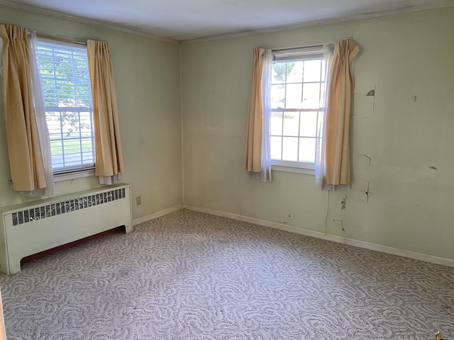 154 Wall St, Meriden, CT 06475 - empty room featuring radiator heating unit, carpet flooring, crown molding, and baseboards