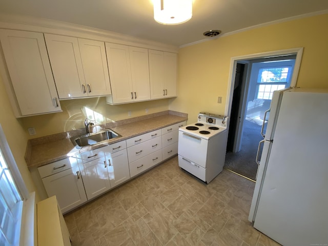 154 Wall St, Meriden, CT 06475 - kitchen featuring white appliances, a sink, white cabinetry, ornamental molding, and light countertops