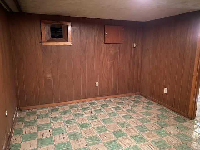 154 Wall St, Meriden, CT 06475 - finished below grade area featuring wood walls, light floors, and baseboards