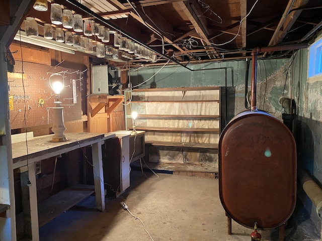 154 Wall St, Meriden, CT 06475 - unfinished basement featuring oil tank and a workshop area