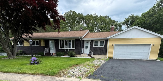 15 Zolan Dr, East Haven, CT 06513 - ranch-style house featuring asphalt driveway, entry steps, an attached garage, a front lawn, and brick siding