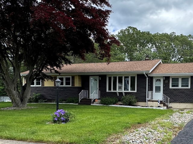 15 Zolan Dr, East Haven, CT 06513 - ranch-style home with brick siding, a front lawn, and a shingled roof