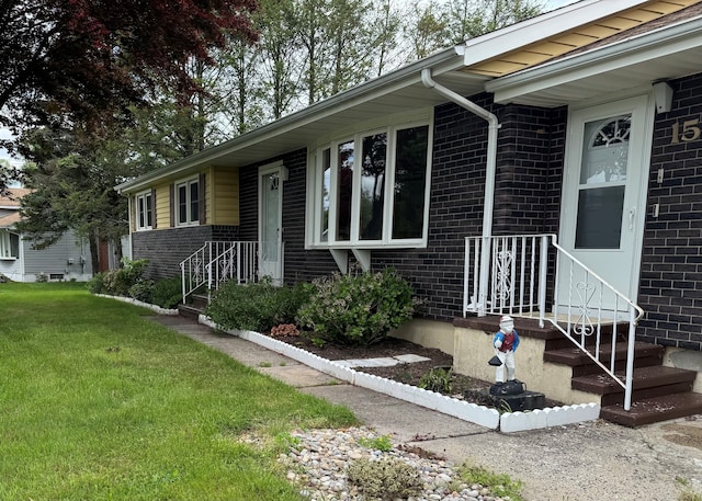 15 Zolan Dr, East Haven, CT 06513 - view of front of property featuring brick siding and a front yard