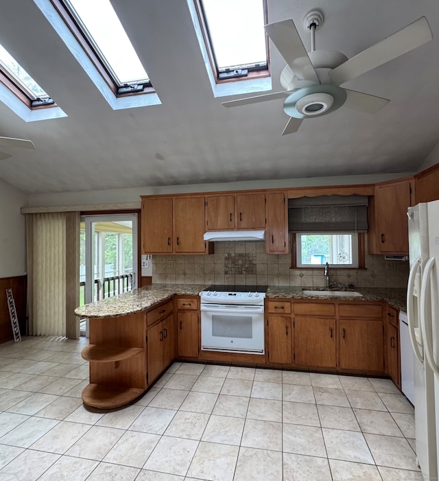 15 Zolan Dr, East Haven, CT 06513 - kitchen featuring white appliances, a ceiling fan, under cabinet range hood, a skylight, and lofted ceiling