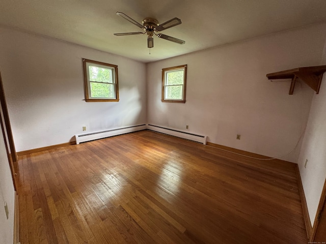 15 Zolan Dr, East Haven, CT 06513 - unfurnished room featuring baseboard heating, a ceiling fan, wood finished floors, and baseboards