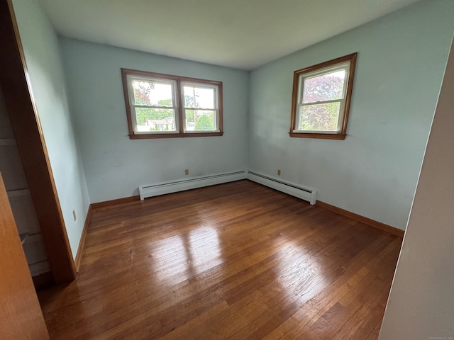 15 Zolan Dr, East Haven, CT 06513 - empty room featuring plenty of natural light, wood finished floors, and baseboards