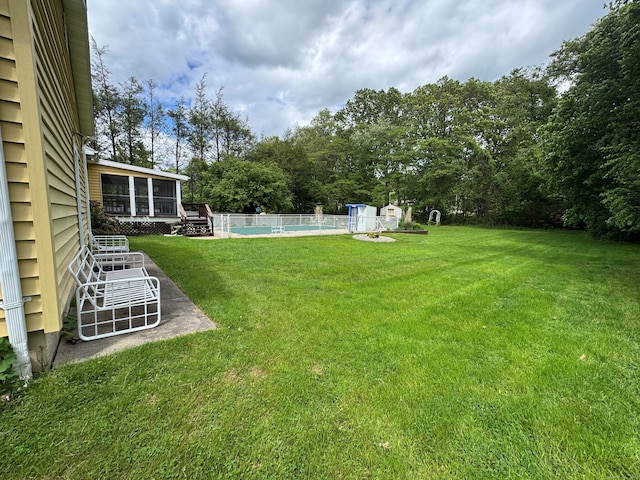 15 Zolan Dr, East Haven, CT 06513 - view of green lawn featuring a sunroom