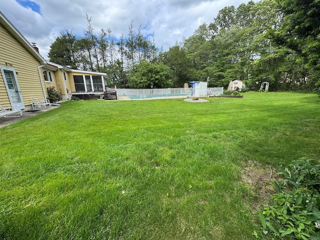 15 Zolan Dr, East Haven, CT 06513 - view of yard with a wooden deck, a sunroom, and view of scattered trees