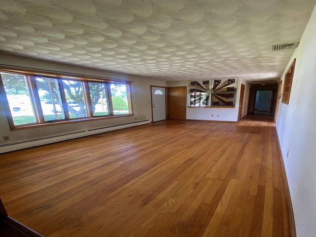 15 Zolan Dr, East Haven, CT 06513 - unfurnished living room with baseboard heating and wood finished floors