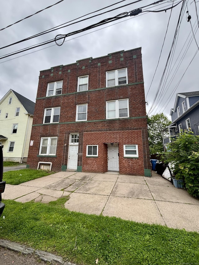 40 Dewey St, New Britain, CT 06051 - view of front of home featuring brick siding and a patio