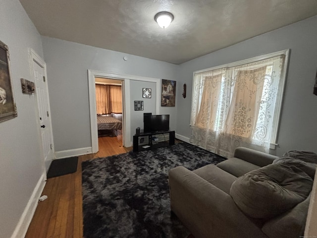 40 Dewey St, New Britain, CT 06051 - living room featuring baseboards and wood finished floors