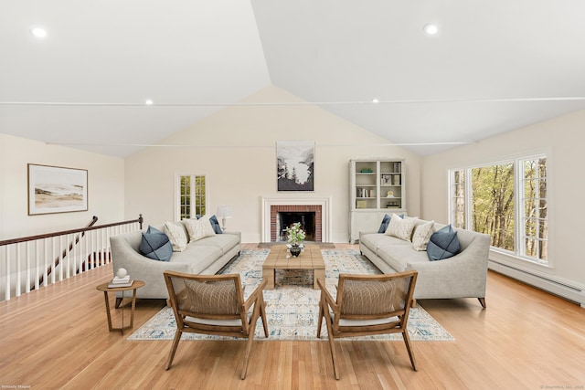 24 Newtown Tpke, Redding, CT 06896 - living area with vaulted ceiling, light wood-style floors, plenty of natural light, a brick fireplace, and recessed lighting