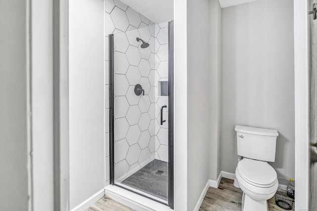 32 Old Bethel Rd, Newtown, CT 06470 - bathroom featuring a stall shower, wood finished floors, toilet, and baseboards