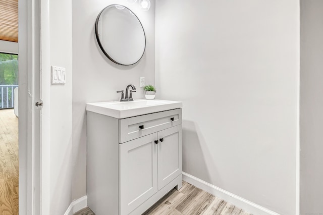 32 Old Bethel Rd, Newtown, CT 06470 - bathroom with wood finished floors, baseboards, and vanity