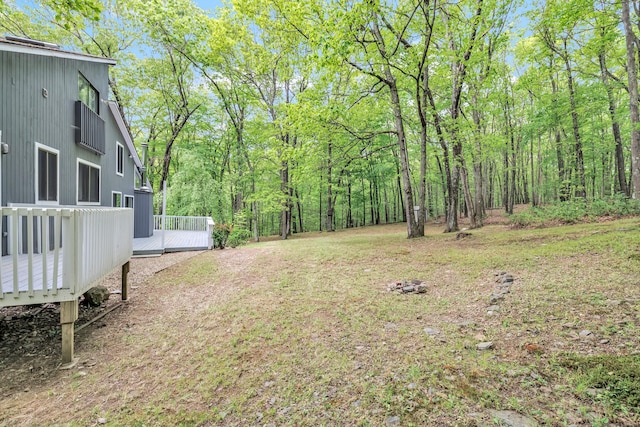 32 Old Bethel Rd, Newtown, CT 06470 - view of yard featuring a deck and a view of trees