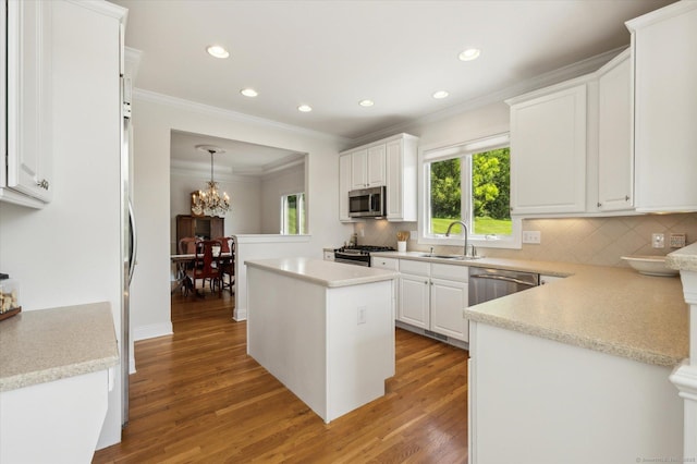 7 Wyndemere Unit 7, Avon, CT 06001 - kitchen with appliances with stainless steel finishes, a sink, light wood-style flooring, recessed lighting, and white cabinets