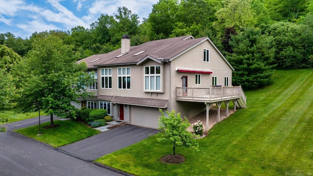 7 Wyndemere Unit 7, Avon, CT 06001 - view of front of home featuring a garage, a chimney, a front lawn, a deck, and asphalt driveway