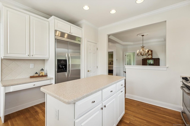 7 Wyndemere Unit 7, Avon, CT 06001 - kitchen with stainless steel built in fridge, a chandelier, dark wood finished floors, decorative backsplash, and white cabinetry