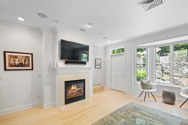 442 Main Ave Unit 18 B6, Norwalk, CT 06851 - living area with a tiled fireplace, crown molding, wood finished floors, baseboards, and recessed lighting