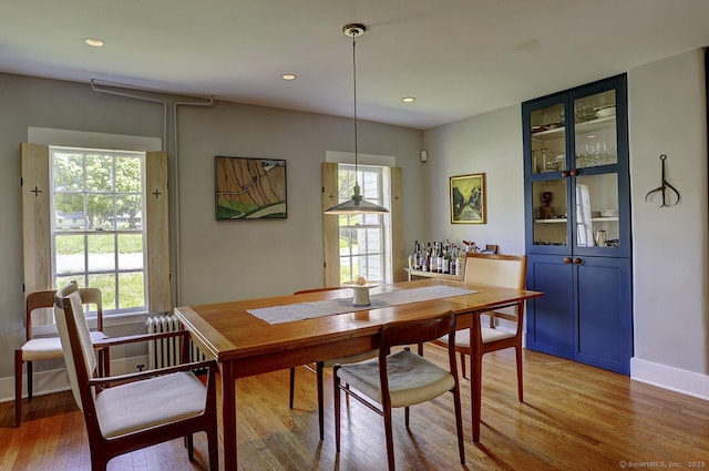 dining room featuring light wood-style floors, recessed lighting, and baseboards