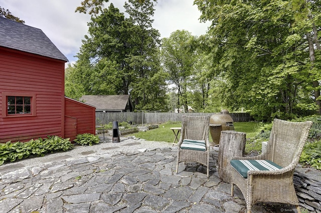 fenced backyard with a patio area