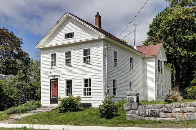 view of front of property with a chimney