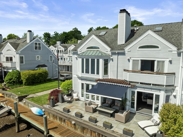 233 Front St Unit 3, New Haven, CT 06513 - rear view of property with outdoor lounge area, a shingled roof, a patio, and a chimney