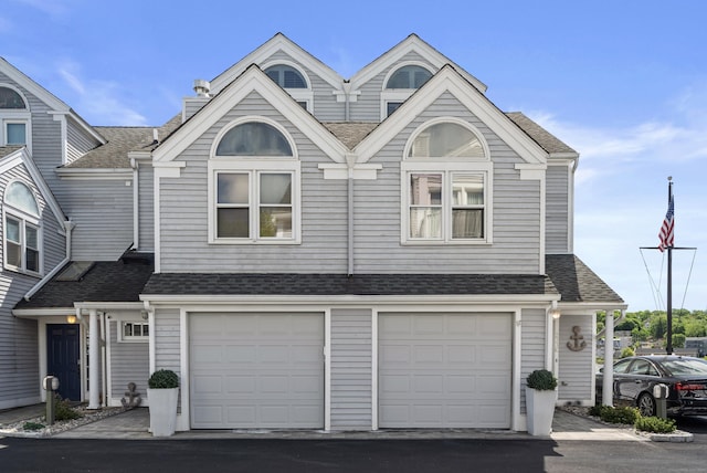 233 Front St Unit 3, New Haven, CT 06513 - view of property featuring driveway, a garage, and a shingled roof