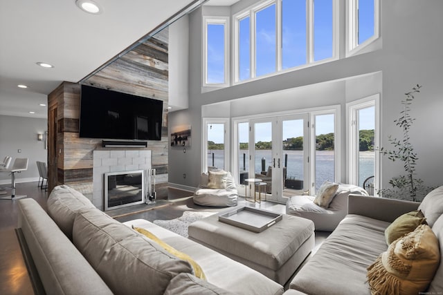 233 Front St Unit 3, New Haven, CT 06513 - living room featuring baseboards, recessed lighting, wood finished floors, a fireplace, and a high ceiling