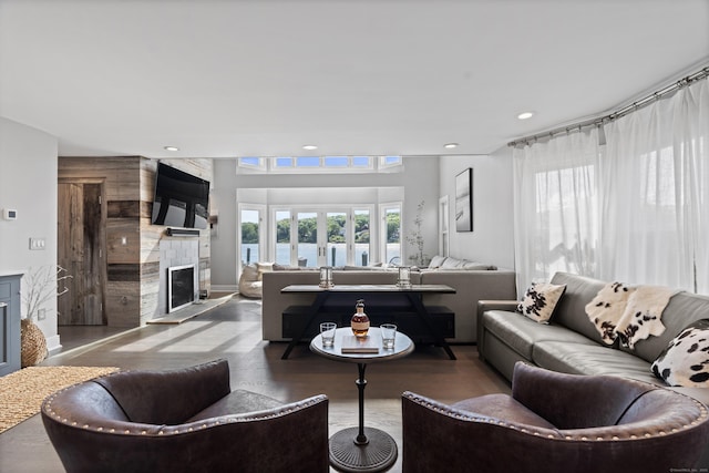233 Front St Unit 3, New Haven, CT 06513 - living room featuring a high end fireplace, wood finished floors, and recessed lighting