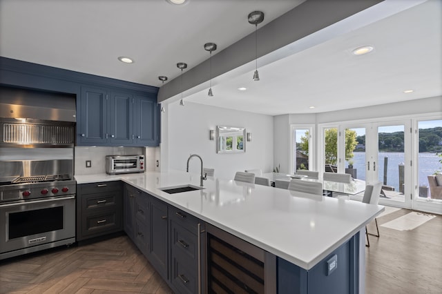 233 Front St Unit 3, New Haven, CT 06513 - kitchen with a sink, wine cooler, a peninsula, light countertops, and recessed lighting