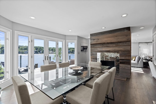 233 Front St Unit 3, New Haven, CT 06513 - dining room with recessed lighting, wood finished floors, french doors, a large fireplace, and a water view