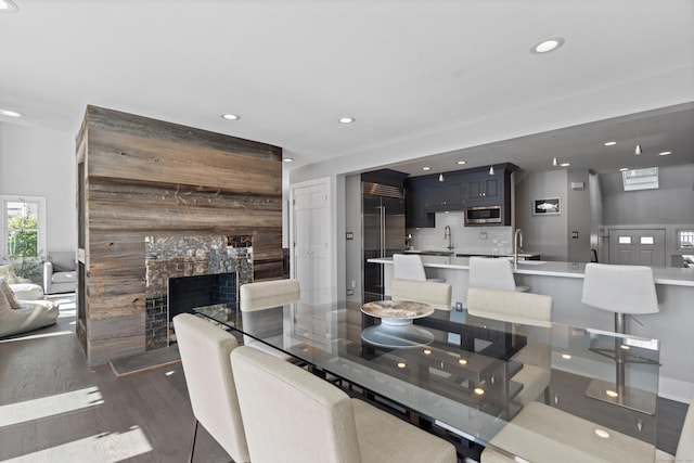 233 Front St Unit 3, New Haven, CT 06513 - dining room with recessed lighting, dark wood-style floors, and a large fireplace