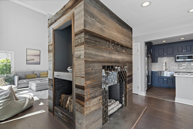 233 Front St Unit 3, New Haven, CT 06513 - living room featuring a multi sided fireplace, dark wood-type flooring, and recessed lighting