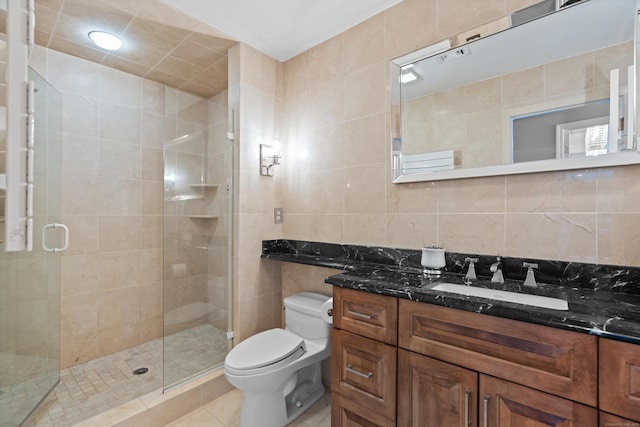 233 Front St Unit 3, New Haven, CT 06513 - bathroom with tile walls, a shower stall, toilet, vanity, and tile patterned floors