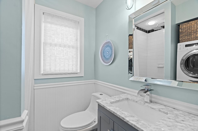 233 Front St Unit 3, New Haven, CT 06513 - bathroom featuring washer / clothes dryer, wainscoting, toilet, and vanity