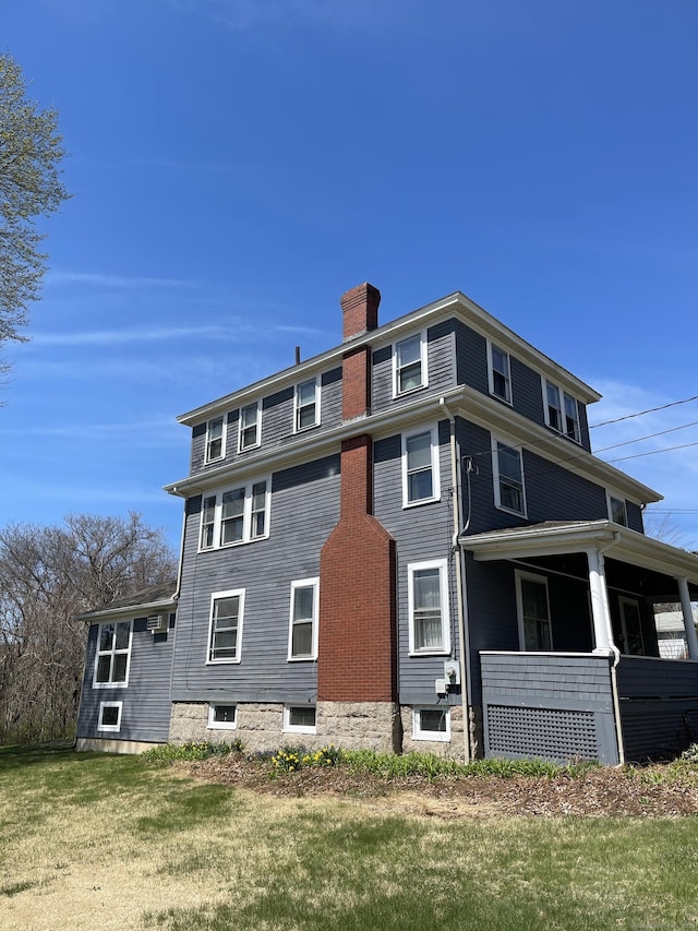 674 Williams St, New London, CT 06320 - view of home's exterior featuring a chimney and a yard