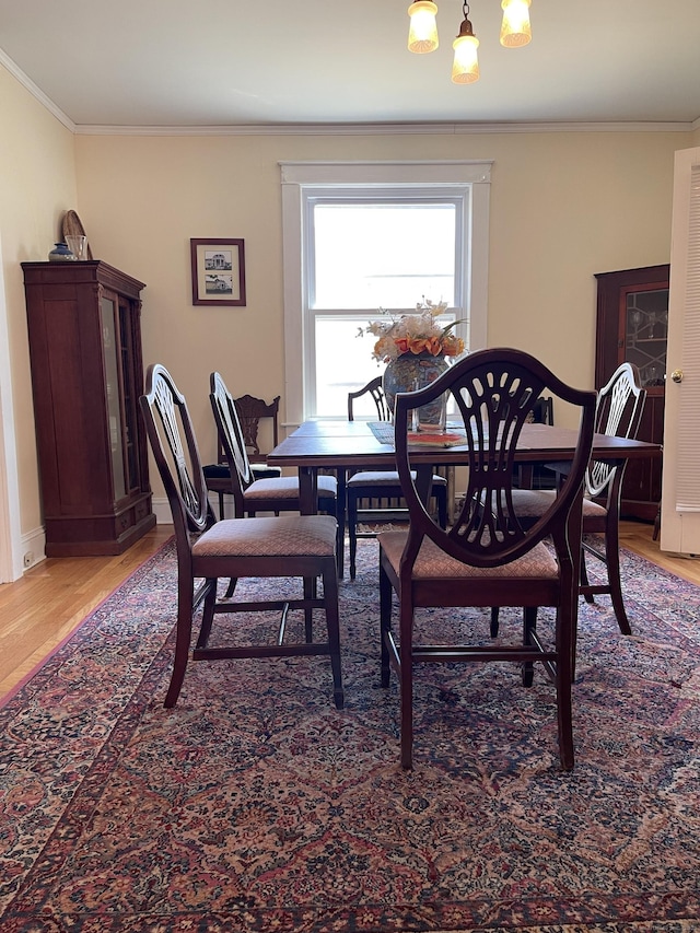 674 Williams St, New London, CT 06320 - dining space featuring light wood-style floors, crown molding, and baseboards