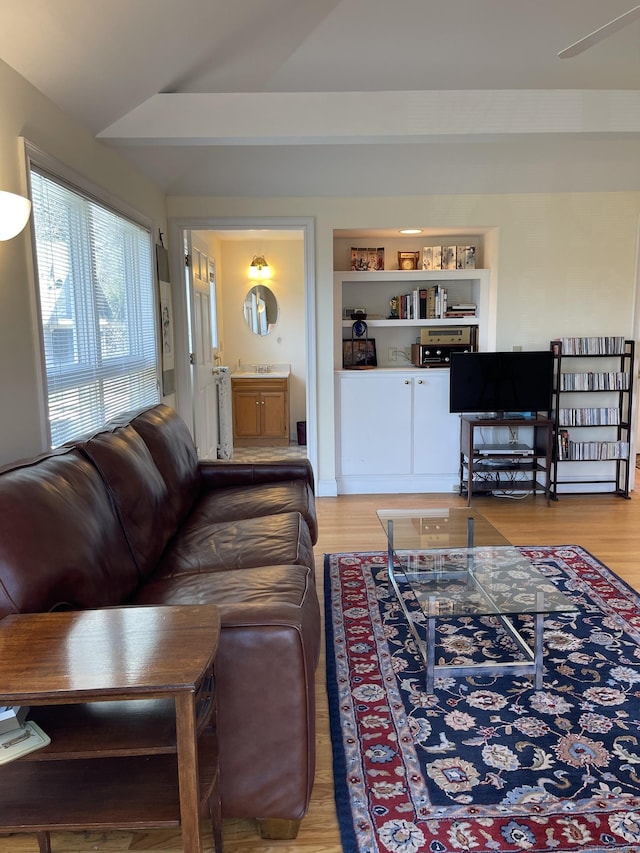 674 Williams St, New London, CT 06320 - living area with wood finished floors and lofted ceiling