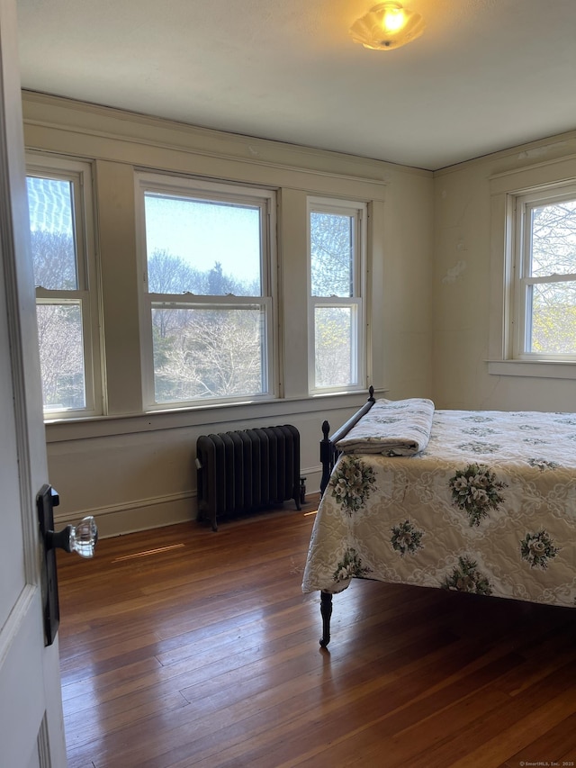 674 Williams St, New London, CT 06320 - bedroom with radiator heating unit, hardwood / wood-style floors, and baseboards