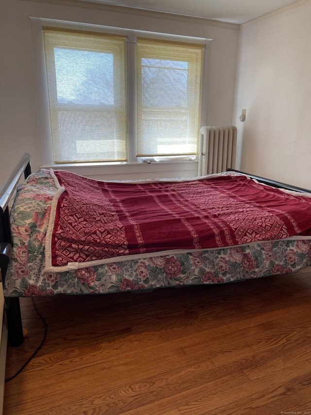 674 Williams St, New London, CT 06320 - bedroom featuring radiator and wood finished floors