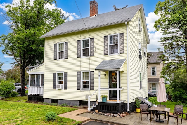 2 Middle Ln, Simsbury, CT 06070 - back of house featuring a chimney, a yard, a sunroom, a patio, and roof with shingles