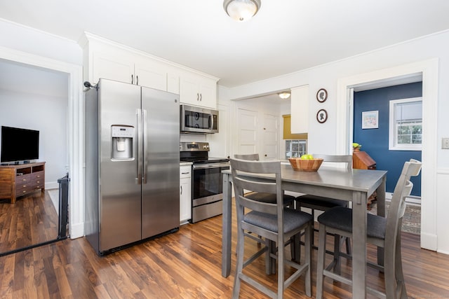 2 Middle Ln, Simsbury, CT 06070 - kitchen featuring appliances with stainless steel finishes, dark wood-style flooring, white cabinets, and baseboards