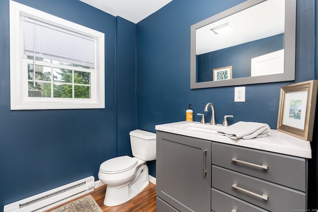 2 Middle Ln, Simsbury, CT 06070 - bathroom with baseboard heating, toilet, wood finished floors, vanity, and baseboards