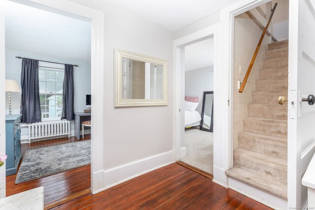 2 Middle Ln, Simsbury, CT 06070 - entryway with radiator heating unit, stairway, wood-type flooring, and baseboards