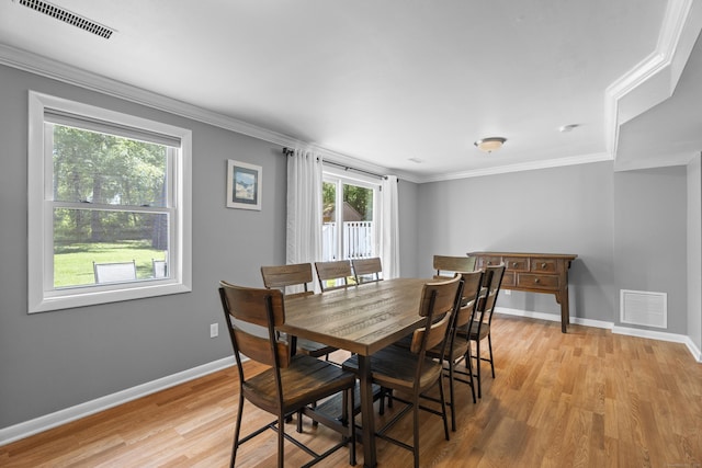 15 Ridgewood Dr, Monroe, CT 06468 - dining area with light wood finished floors, baseboards, and crown molding