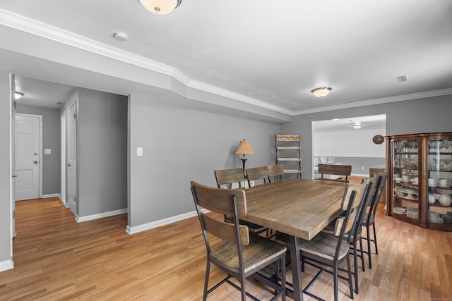 15 Ridgewood Dr, Monroe, CT 06468 - dining area featuring baseboards, light wood finished floors, and crown molding
